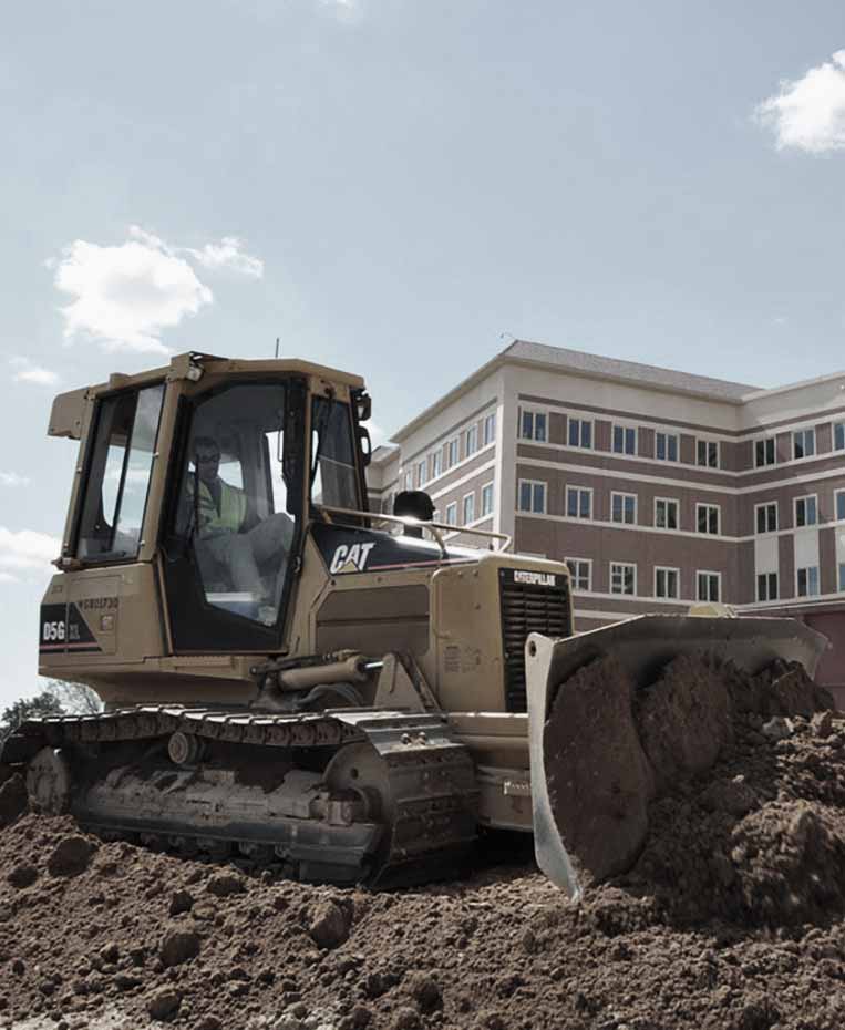 Earthmoving equipment at a Vazquez commercial construction jobsite